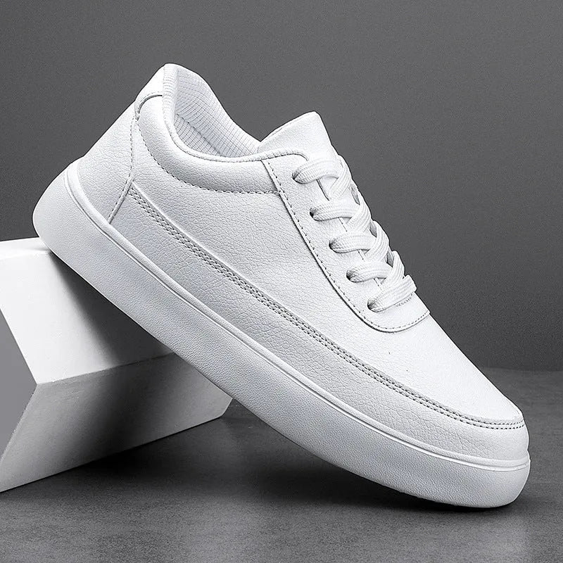 Women's gold leather flat casual lace-up shoes on a white background.