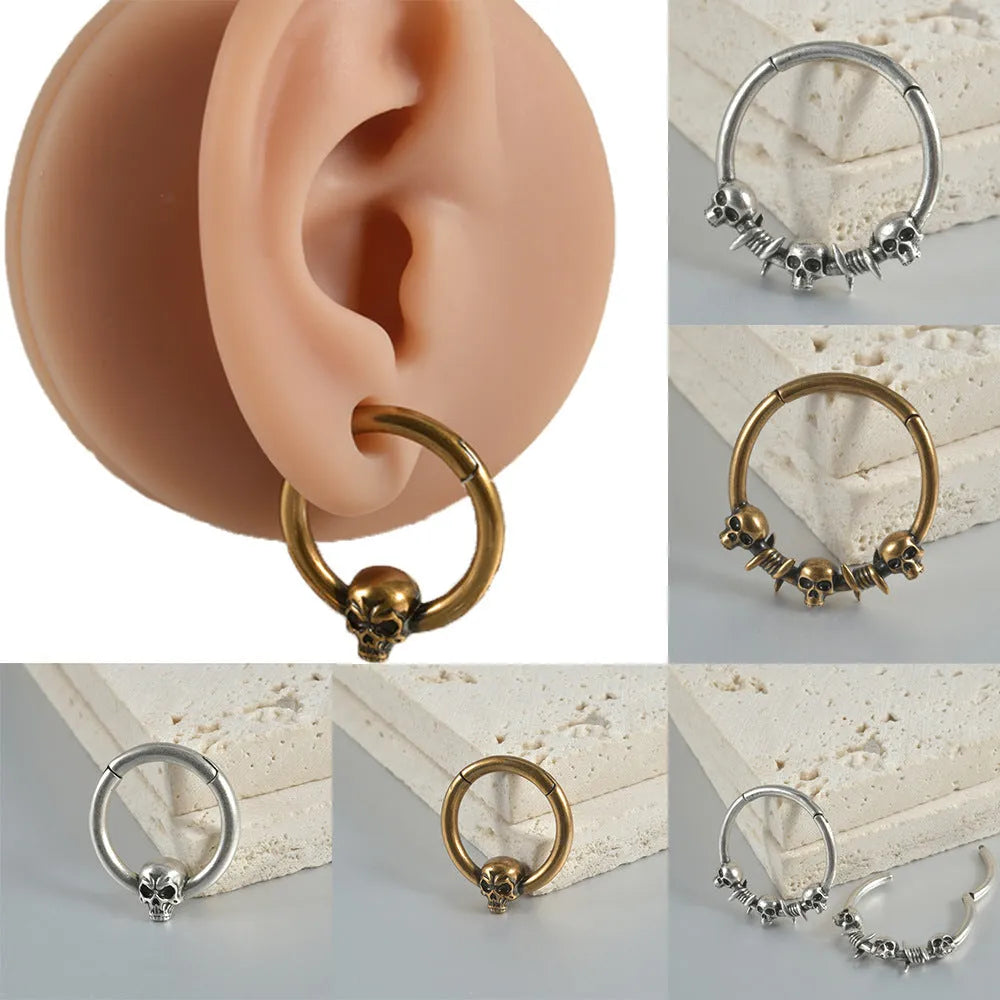 Copper punk earrings with ghost head designs in antique gold or silver finishes