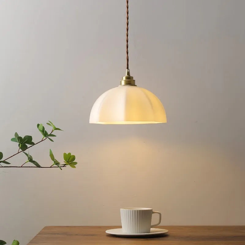 Brass Chinese-style pendant light with copper glass shade for indoor ceiling mounting