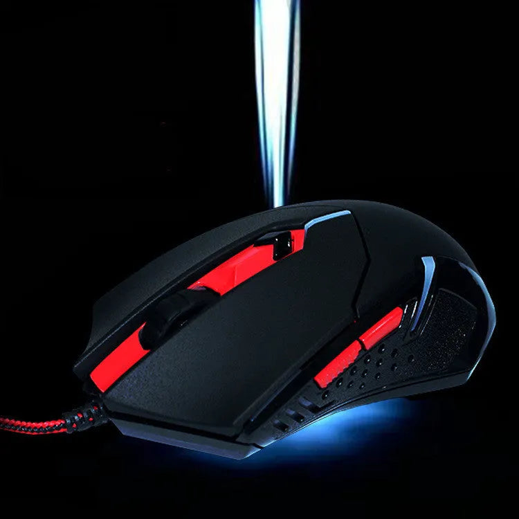Black and red USB wired optical gaming mouse with ergonomic shape on a desk