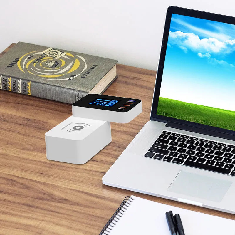 White multi-port USB fast charger with wireless charging pad and EU, UK, US plug adapters on a desk.