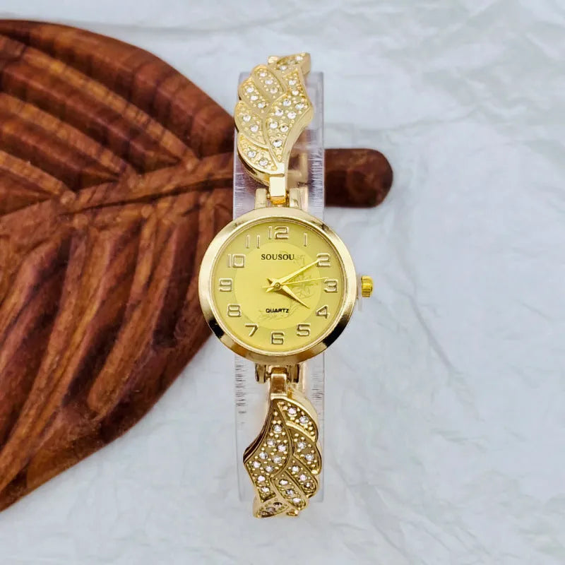 Slim stainless steel women's watch with round dial, shown in gold, black and gold, and white and gold colour variations.