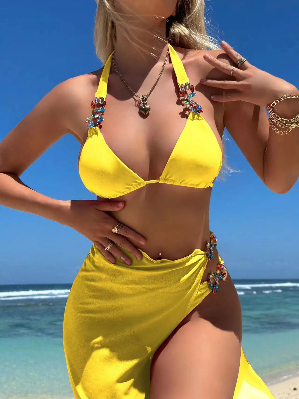 Three-piece swimsuit set with bikini top, pants, and long mesh skirt in rose red or yellow