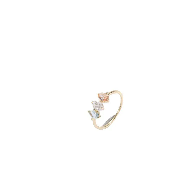 Geometric triangle copper ring with horse eye motif, tricolor zircon, and gold electroplate finish.
