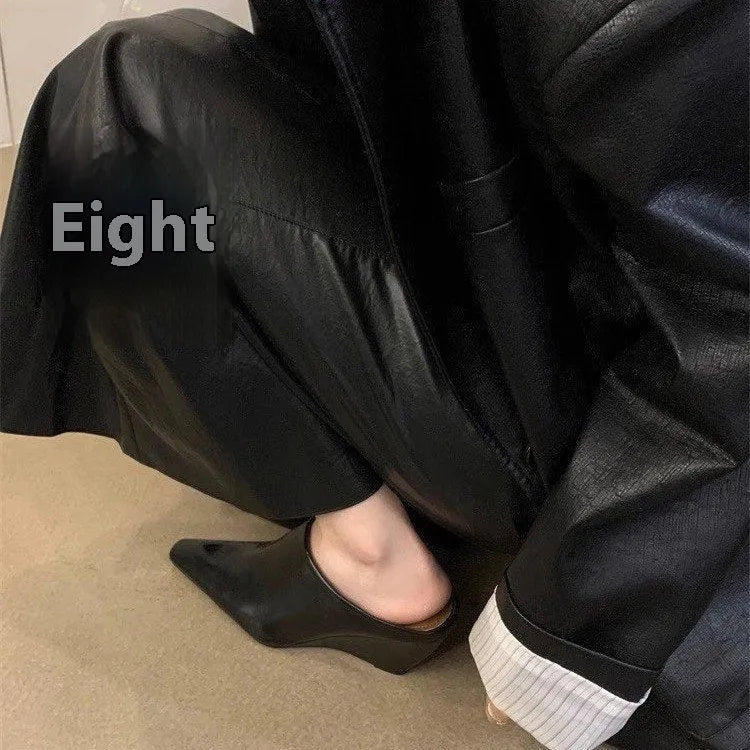 Women's black wind wedge style half slippers with closed toe, made from PU material.