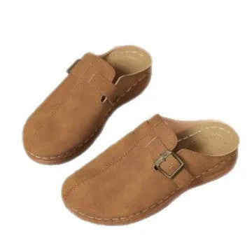 Women's casual wedge slippers in various colours with a cloth upper and rubber sole.