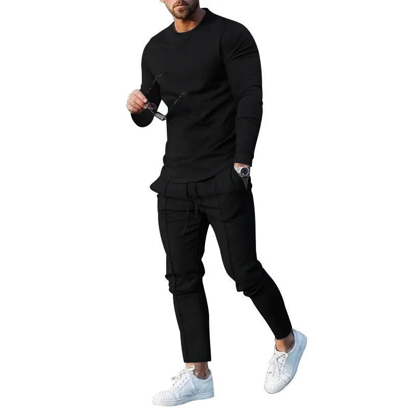 Men's light grey two-piece suit set with long sleeve round neck t-shirt and matching trousers.