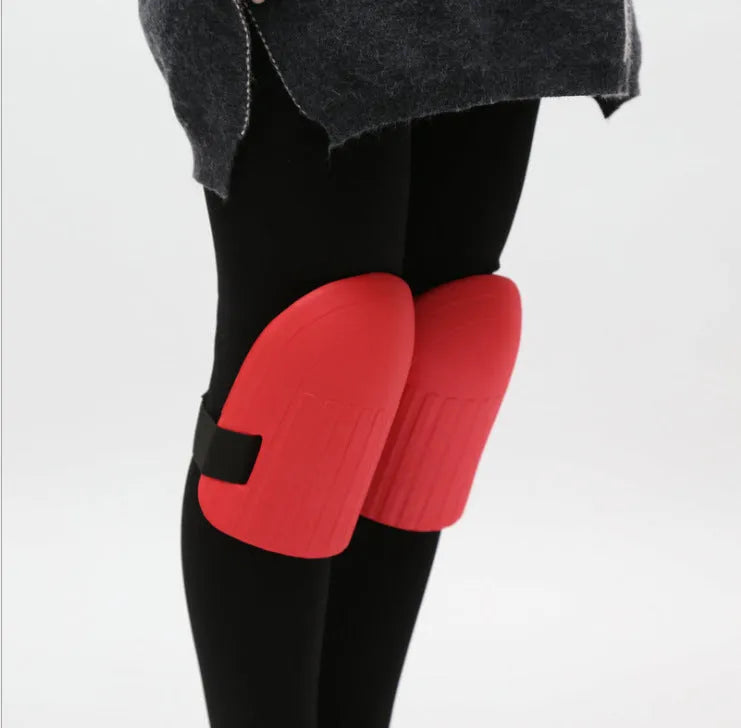 A pair of dense black EVA foam knee pads for gardening, showing size and thickness.
