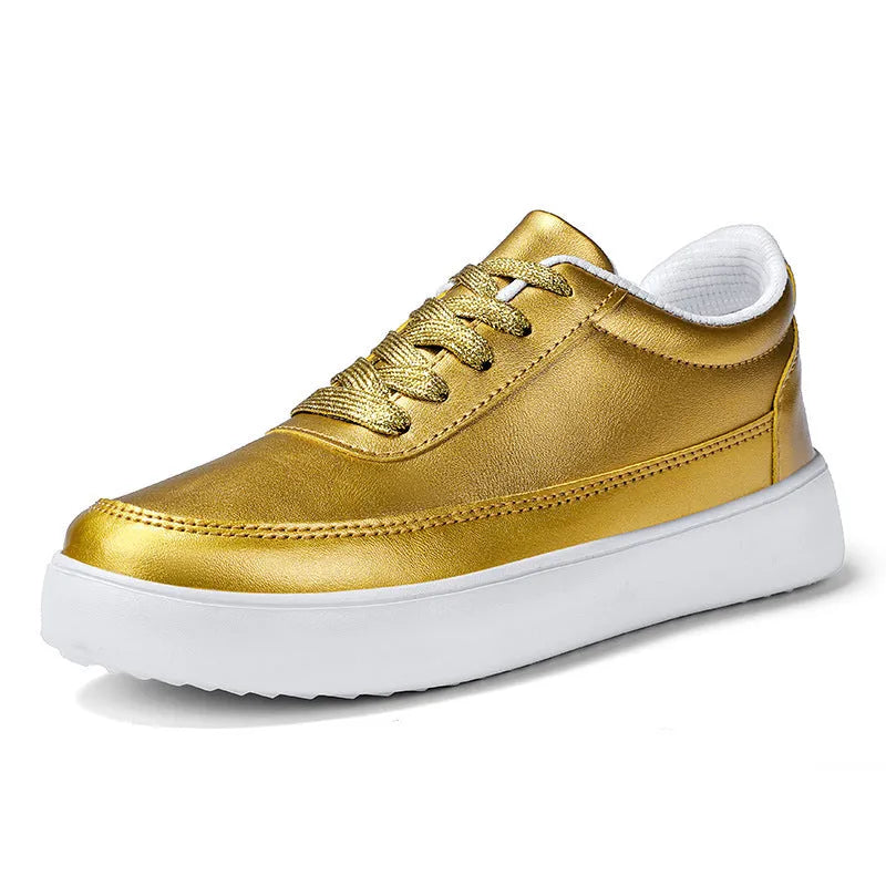 Women's gold leather flat casual lace-up shoes on a white background.