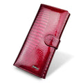 Women's red leather coin purse with crocodile pattern texture and a visible interior pigskin lining.