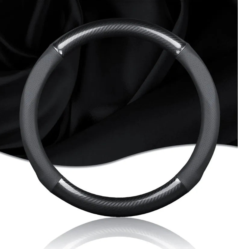 Universal 38cm leather carbon fiber steering wheel cover in mirror black with belt hole and tricolor mark.