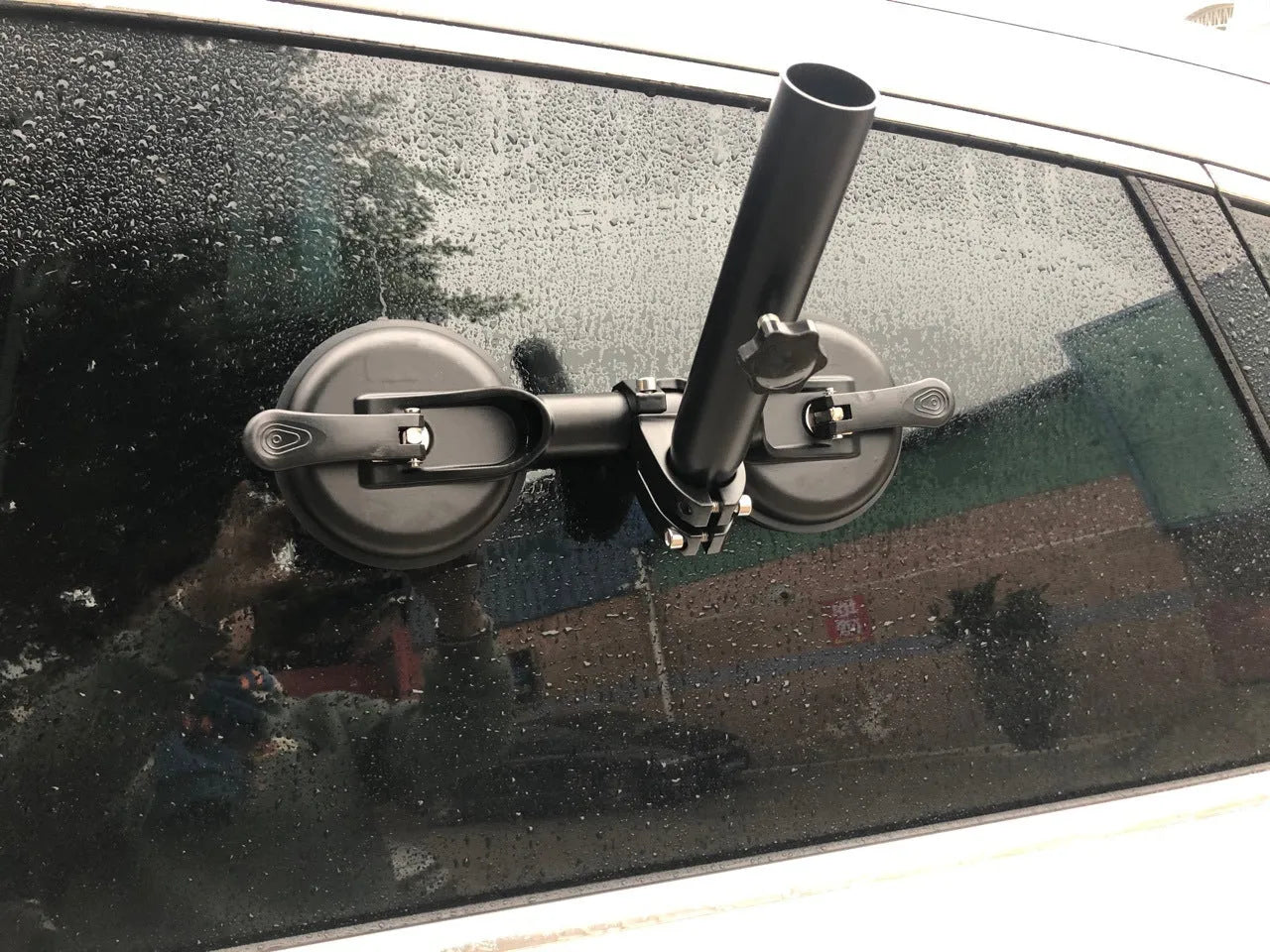 Black off-road car flagpole sucker base with round glass suction cup and rubber disc body.