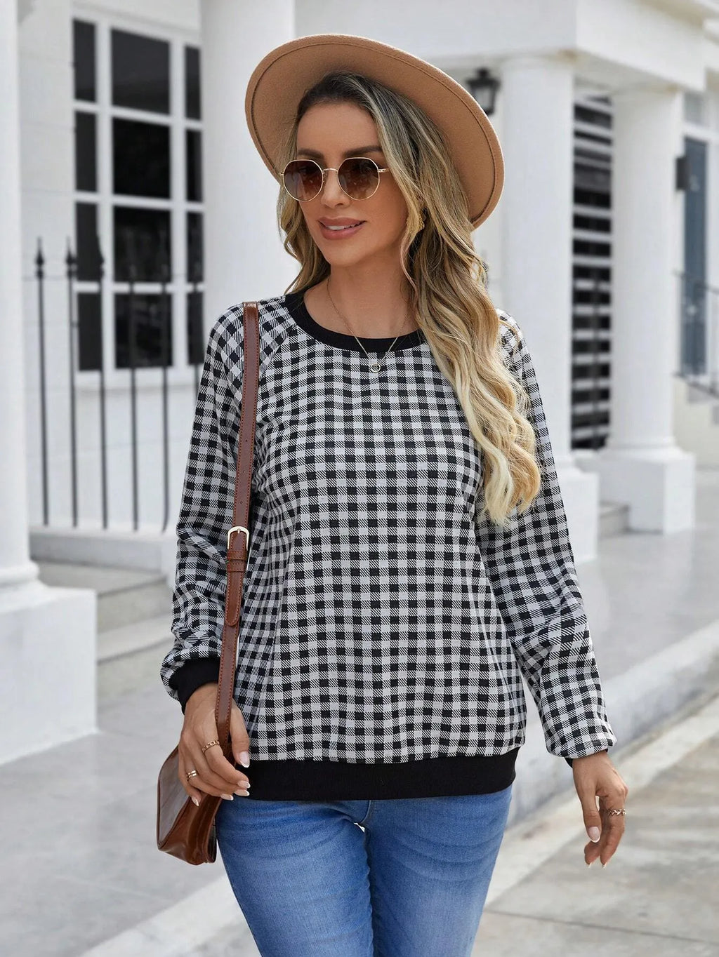 Black men's long sleeve sweater with a striped plaid print pattern.