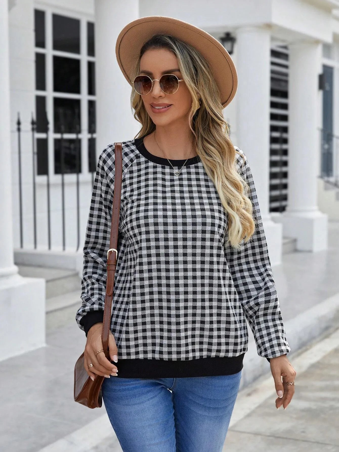 Black men's long sleeve sweater with a striped plaid print pattern.