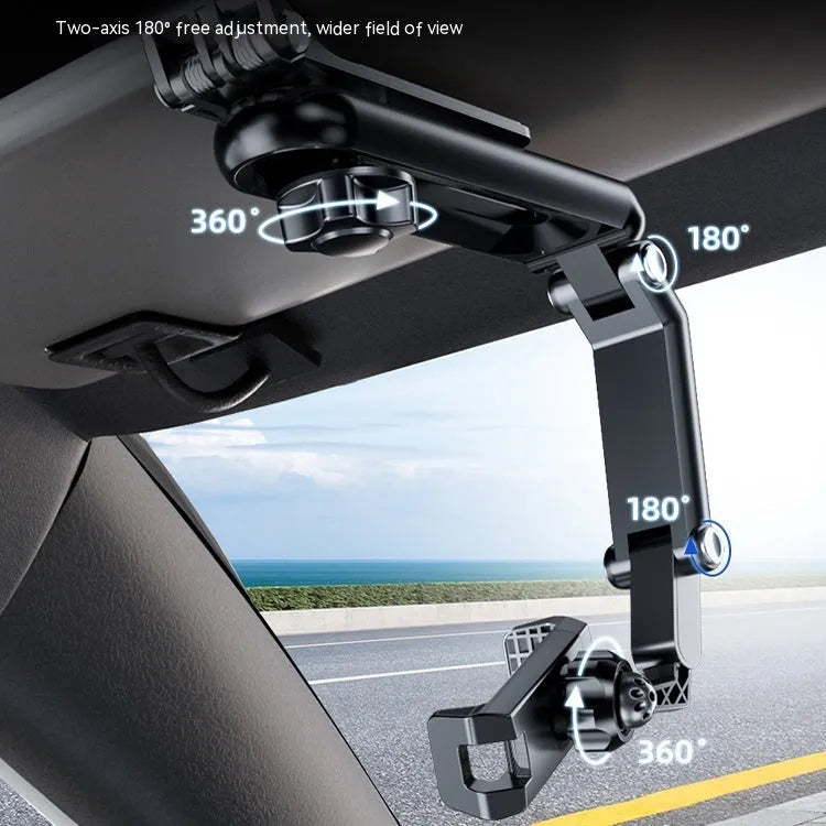 A black and grey car phone holder bracket clipped onto a vehicle air vent.