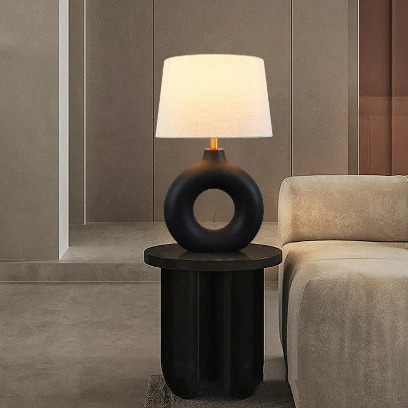 Feng pottery pot table lamp in Japanese style on a wooden desk.