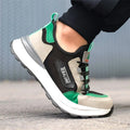 Black green low-cut safety shoes with mesh panels and plastic steel toe caps