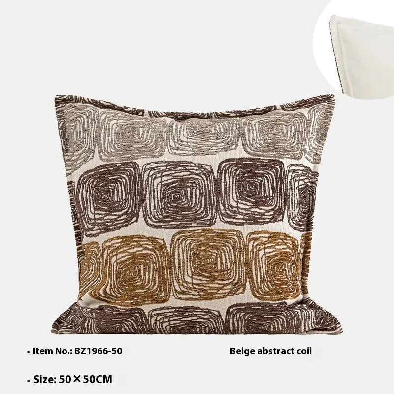 Abstract coil pattern cushion cover with piping trim in cream and coffee colours