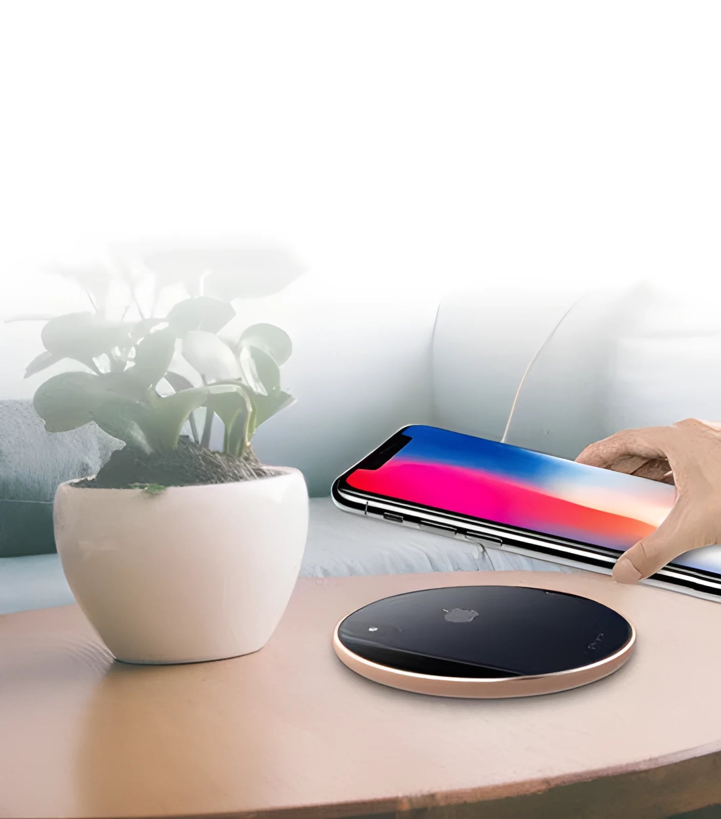 Ultra-thin aluminum wireless charging pad in silver colour on a wooden desk