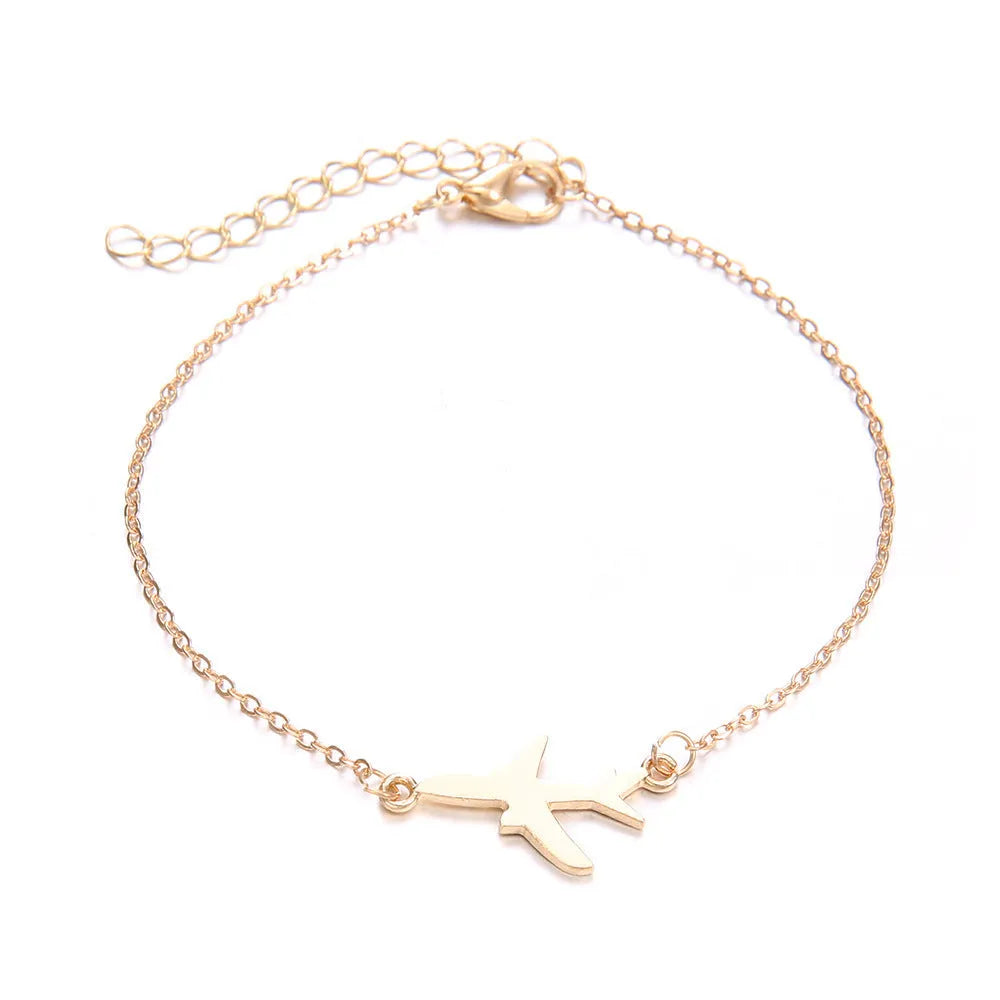 Three bohemian-style bracelets with aircraft map heart charms in electroplated alloy