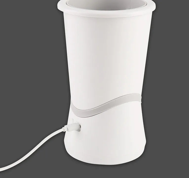White pet electric foot washer with ABS plastic cylindrical body standing on paws