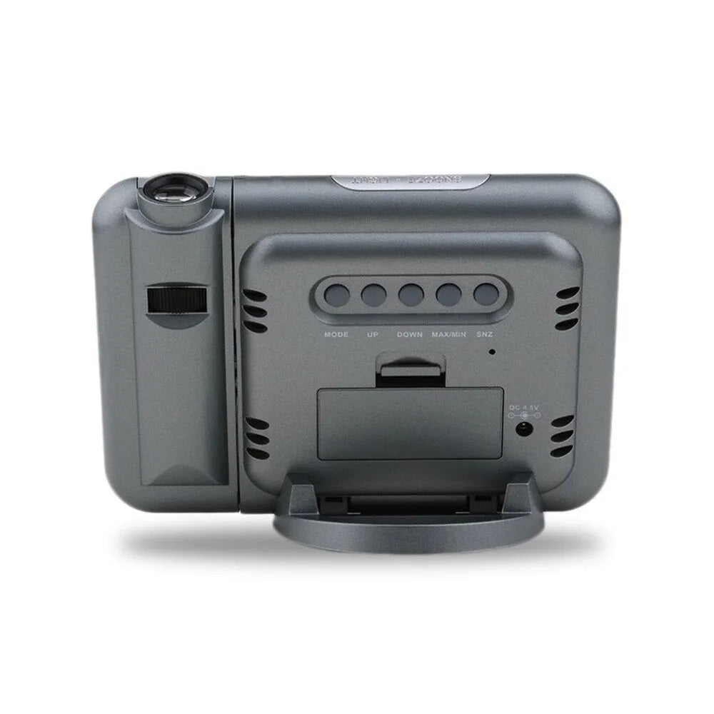 Black digital projection alarm clock showing time display with temperature and humidity readings