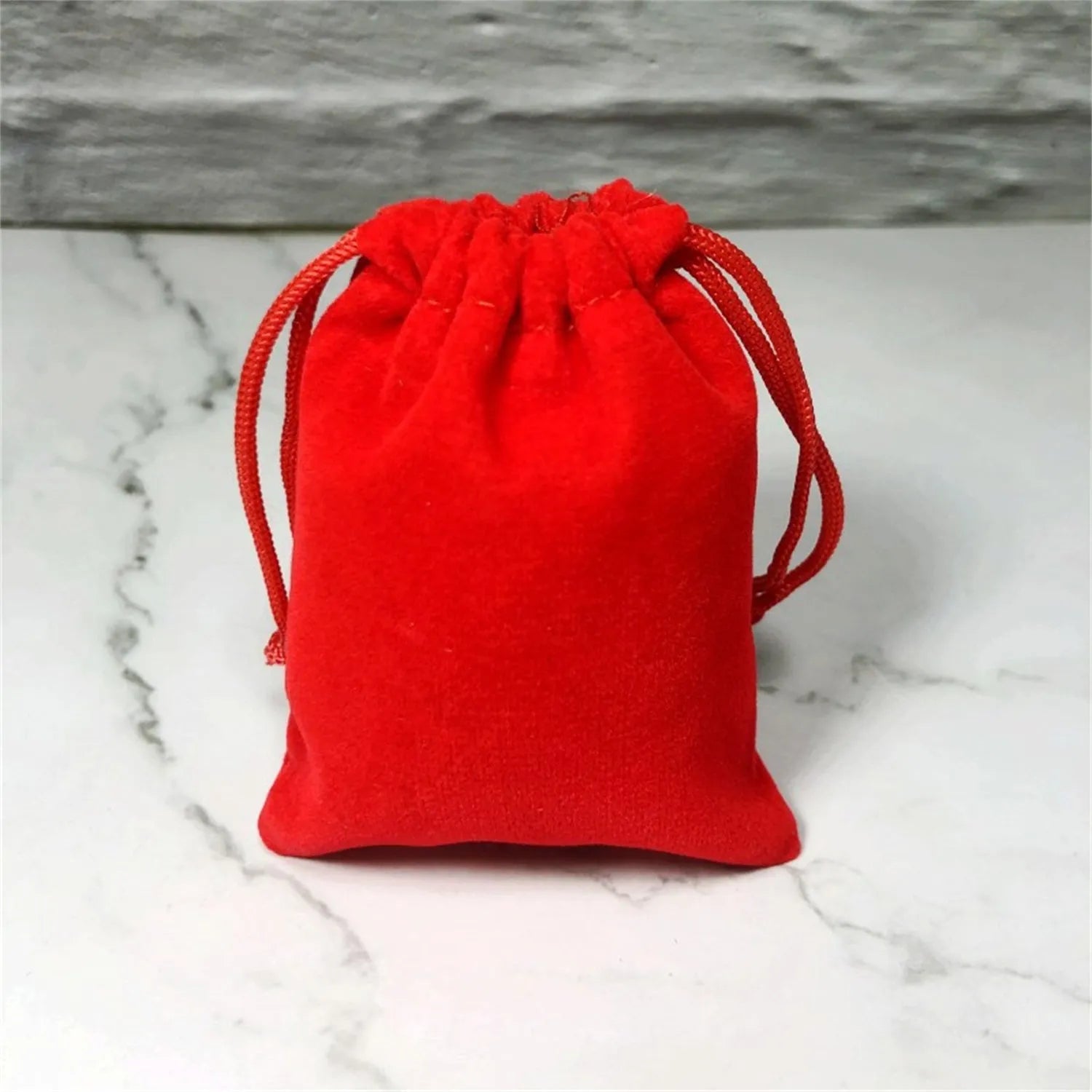 Flannel drawstring bag with beam opening, available in multiple colours and sizes for storage or gifting