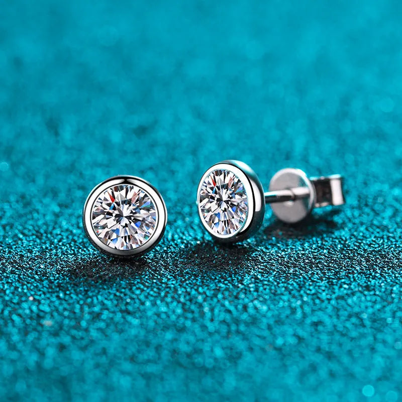 A pair of sterling silver earrings with geometric design and a choice of moissanite or zircon stone.