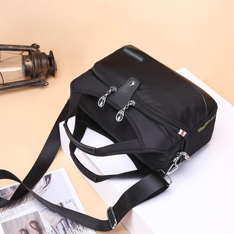 Women's anti-theft crossbody shoulder bag in Oxford cloth with multiple pockets and adjustable strap