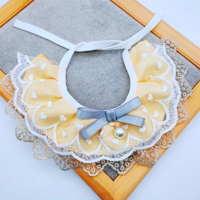 Yellow cotton polyester cat bib with lace trim, princess style, sizes XS S M L, lace and side lacing measurements shown.