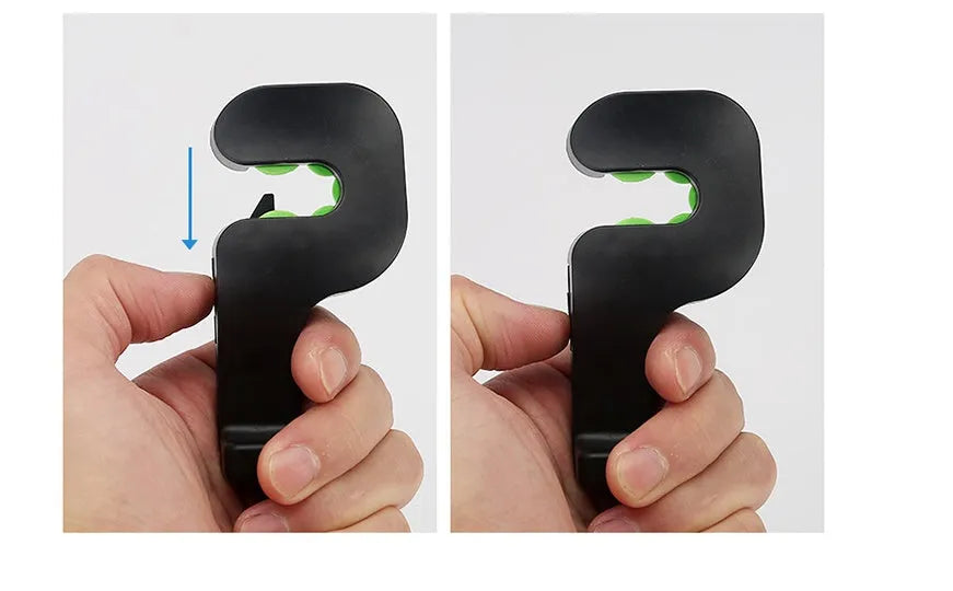 Pair of black plastic concealed car seat back hooks on a car seat back holding a bag