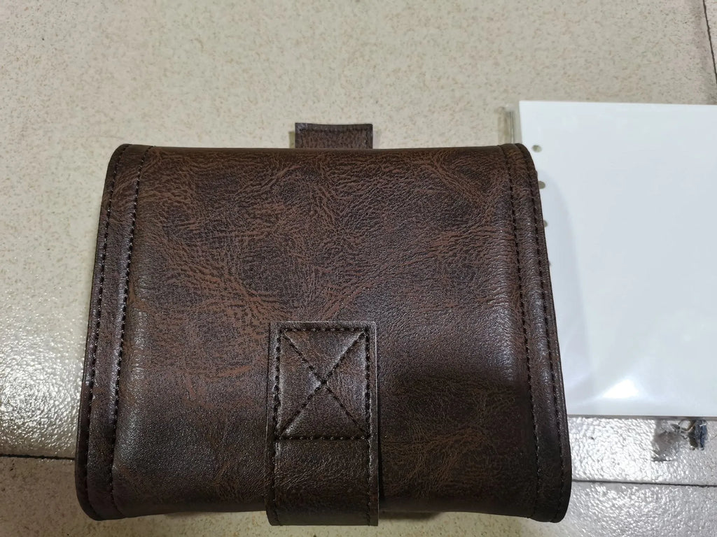 Brown A7 size notebook with a PU leather-look cover and metal buckle closure.