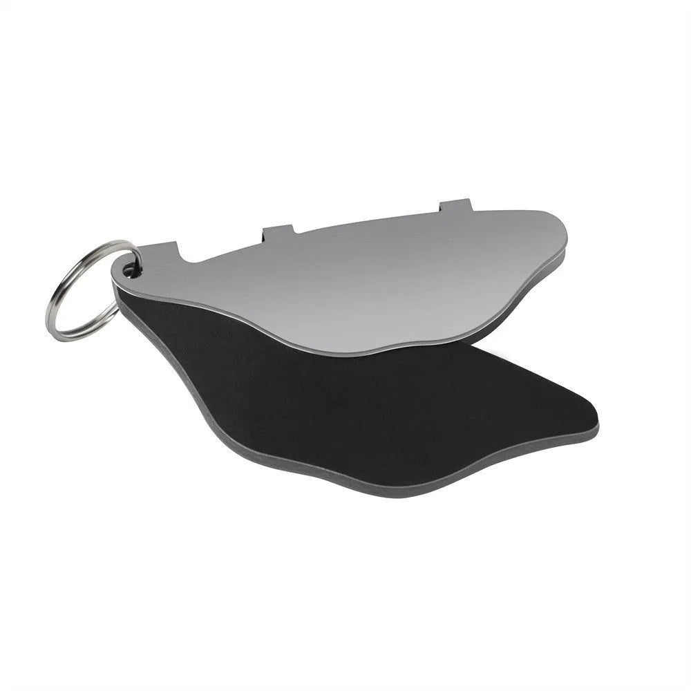 Black and orange mountain bike brake pads with scratch-proof metal linings and adjustment flap