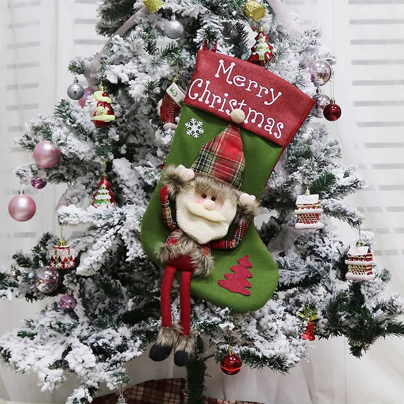Set of three large Christmas stockings with Santa, Snowman, and Reindeer 3D designs hanging on a fireplace