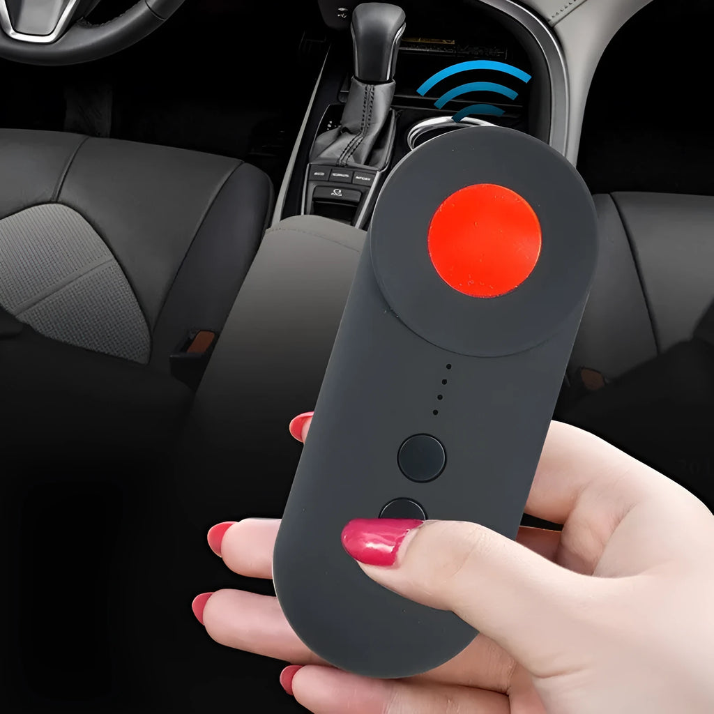 Black portable GPS and hidden camera signal detector showing compact size and Micro USB charging port.