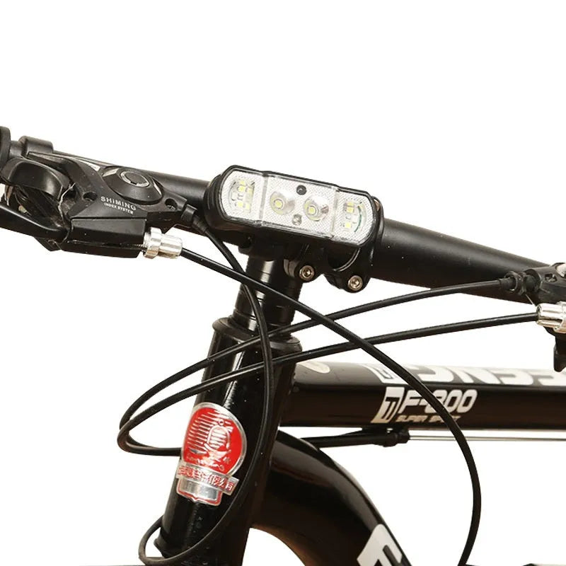 Black bicycle headlight with LED beads, showing 18650 battery compartment