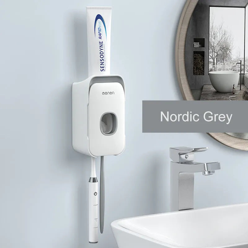 Automatic wall-mounted toothpaste dispenser in blue colour on a bathroom wall.