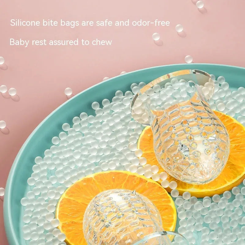 Happy Bite baby teether fruit feeder in transparent edible silicon with hand guard