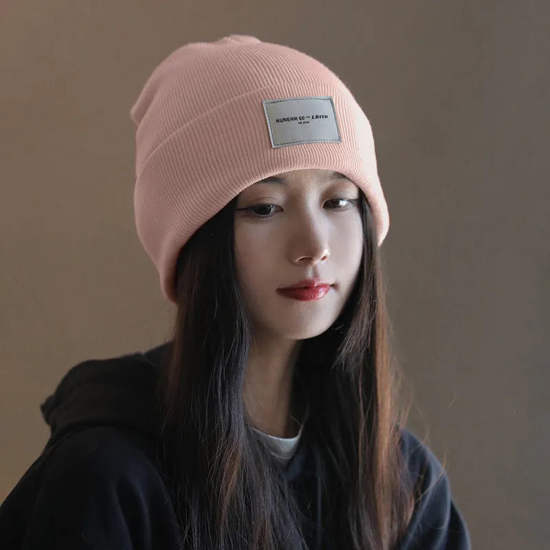 Women's knitted hat in dome crown style, polyester, available in pink, khaki, black, and beige for winter