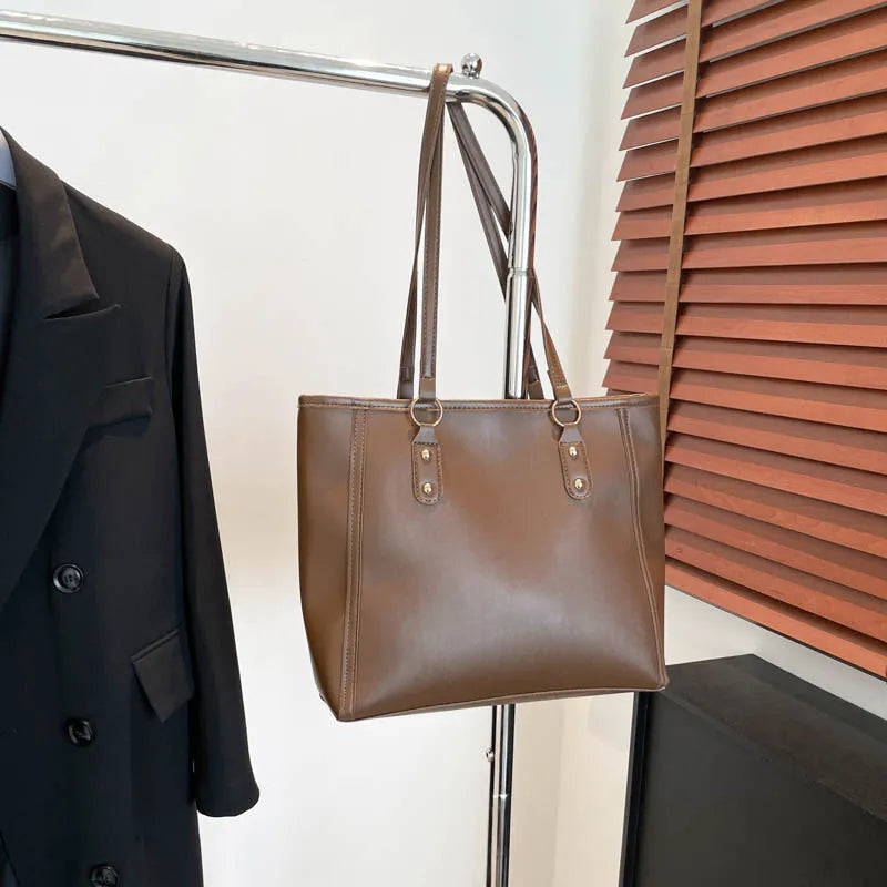 Korean style black PU shoulder underarm bag with a sandwich pocket and horizontal square shape.