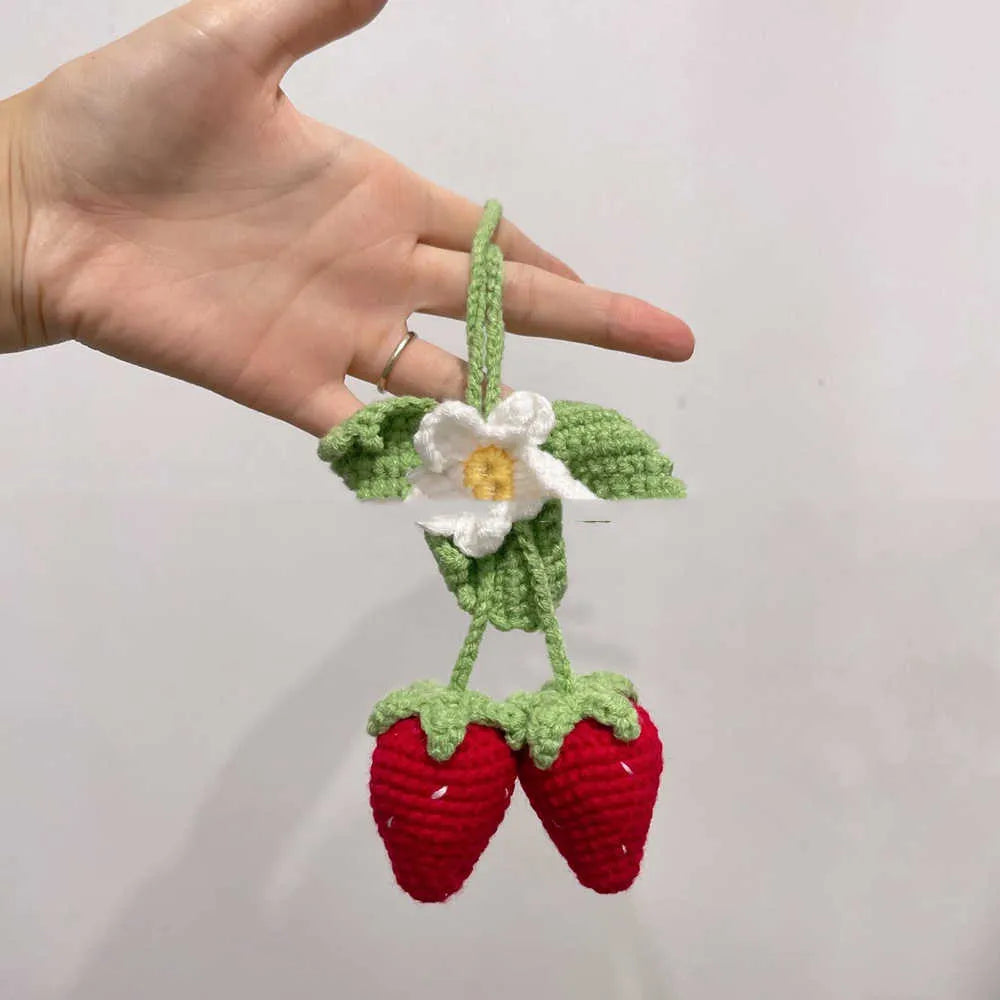 Handmade strawberry-shaped car pendant woven from cotton and hemp, a hanging decorative ornament.