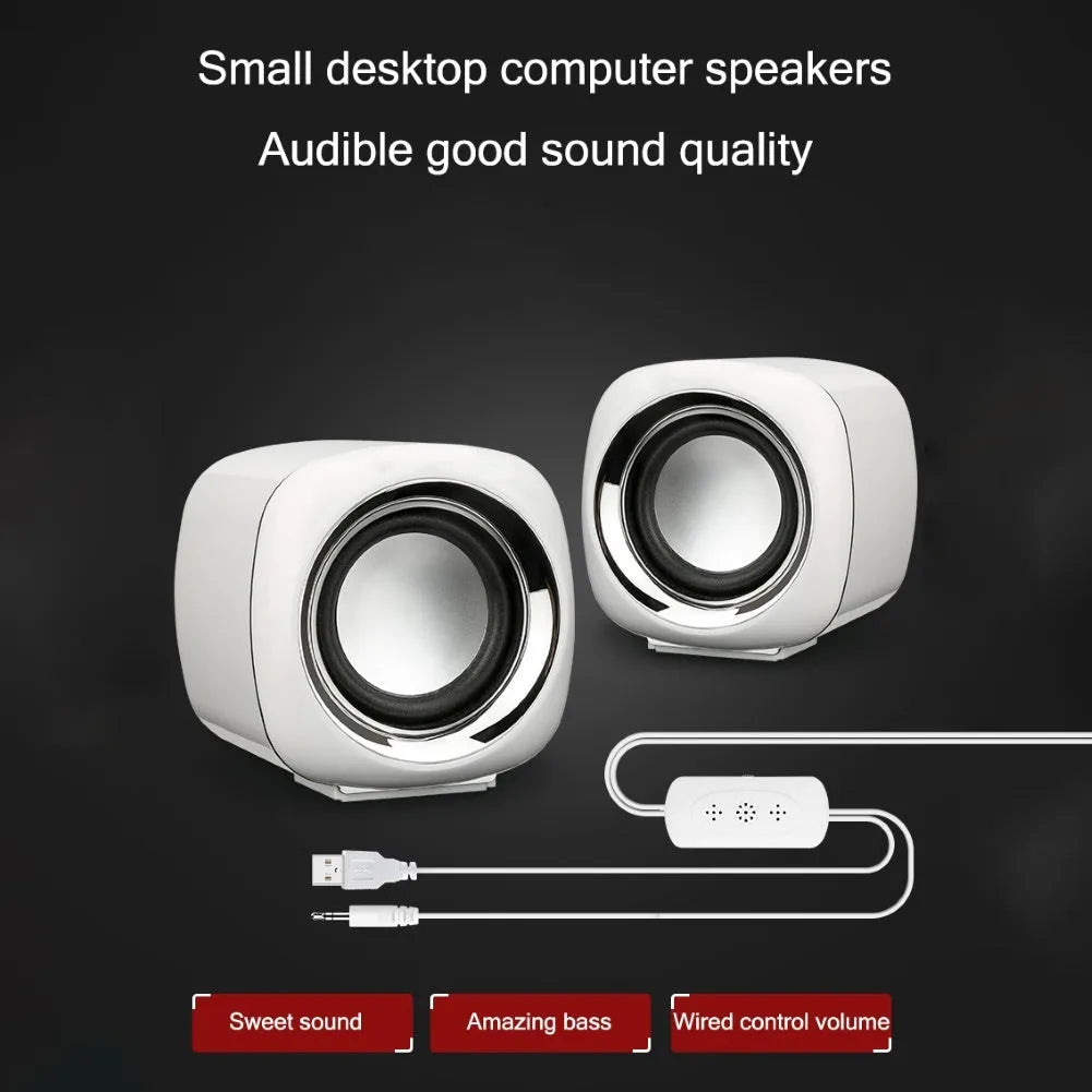 Compact black wired desktop speaker pair with 3.5mm plug measuring 7.2cm