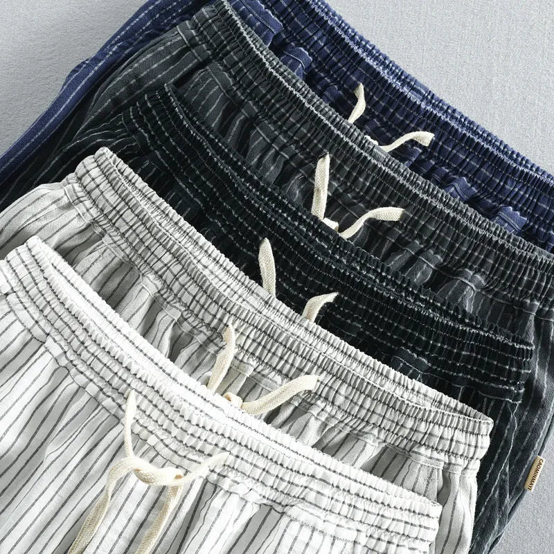 Men's striped cotton casual shorts in a loose straight-leg fit on a mid-waist.