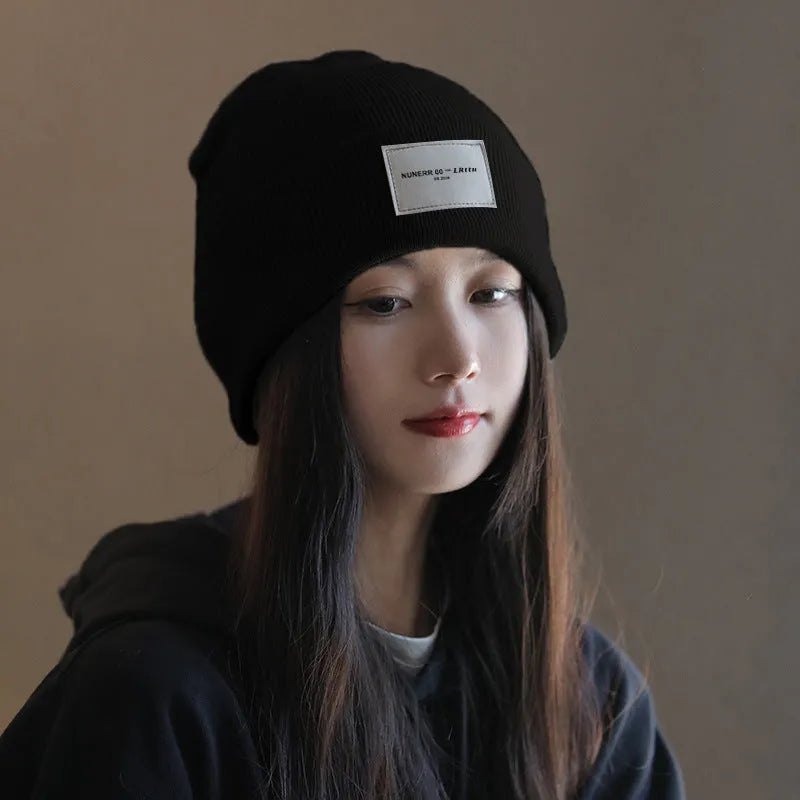 Women's knitted hat in dome crown style, polyester, available in pink, khaki, black, and beige for winter