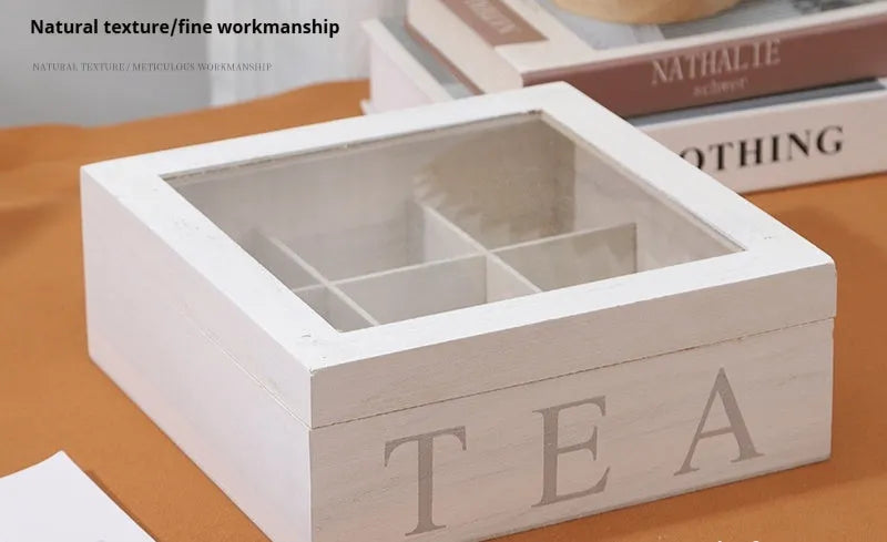 White wooden multi-grid coffee storage box with transparent cover on a desk
