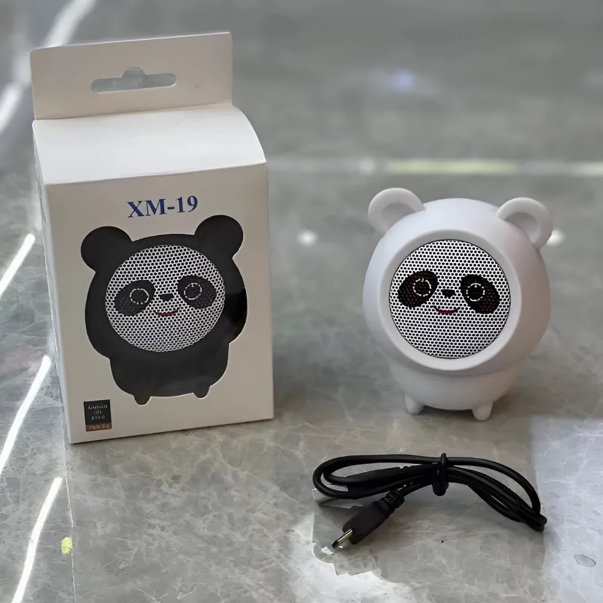 Cartoon panda desktop Bluetooth speaker in plastic, shown in one of five colours: white, pink, blue, black or brown.