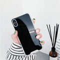 Mirrored front TPU protective case for iPhone in multiple colour options on a table.