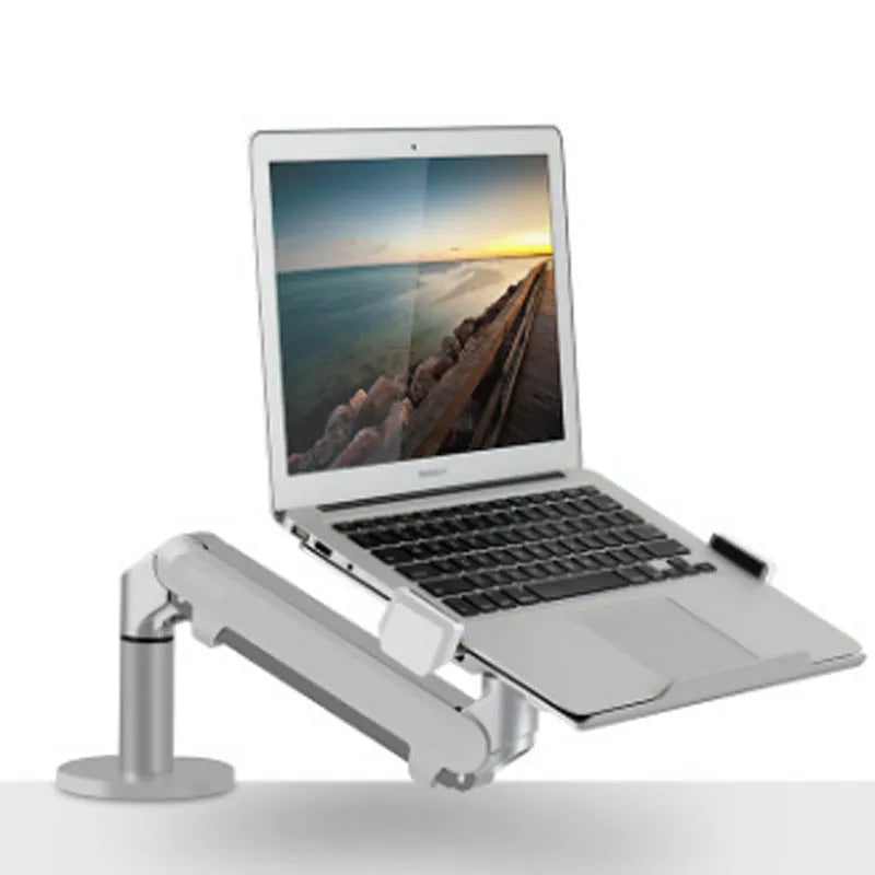 Black aluminium laptop stand with adjustable arm bracket raised above a desk.