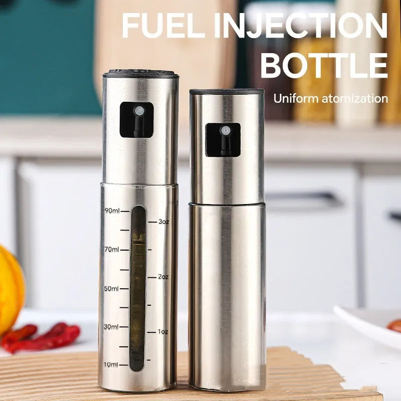 Press-type stainless steel oil spray bottle with 100ml capacity and glass body for kitchen use