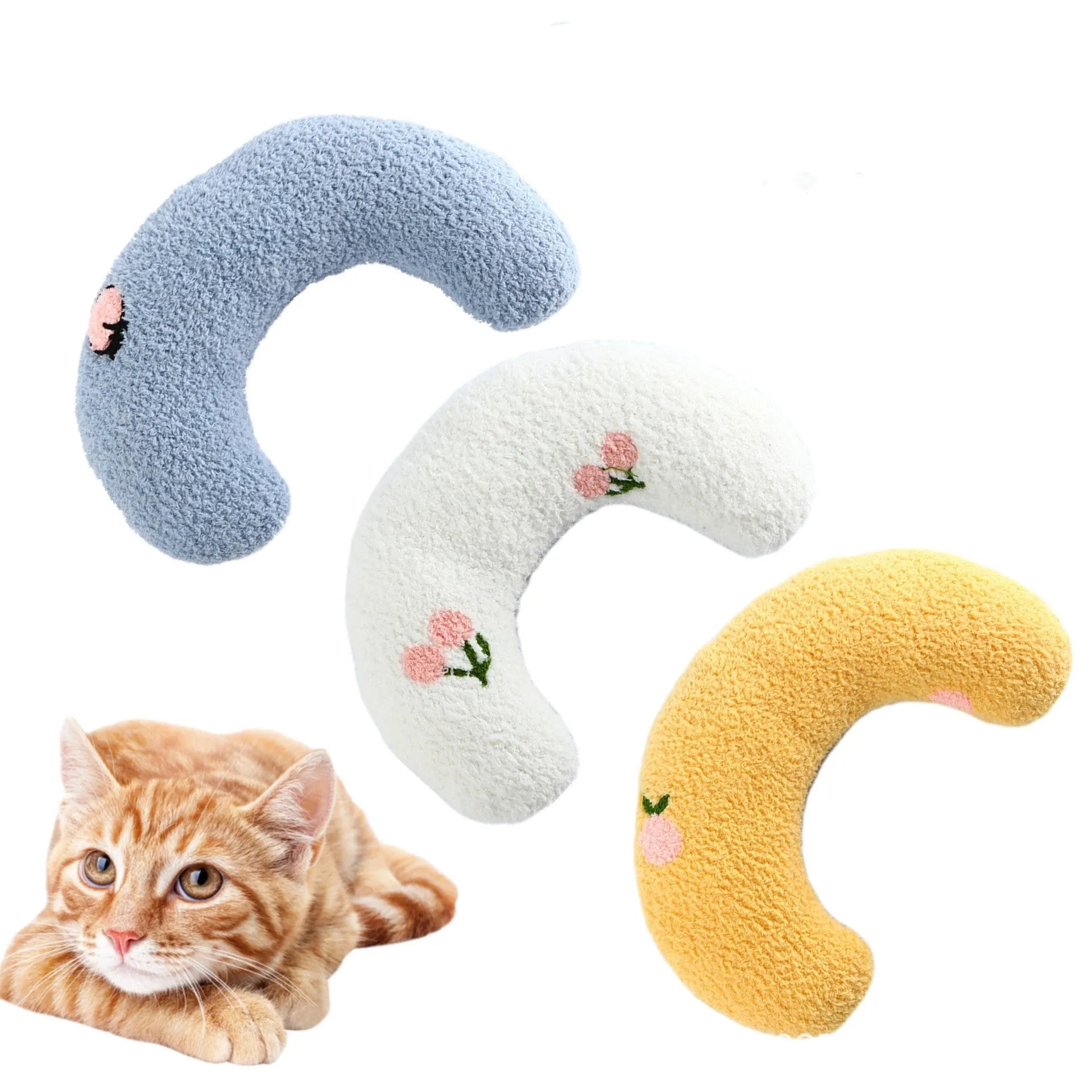 White U-shaped plush pet pillow for a cat, showing its donut shape and quilted texture.